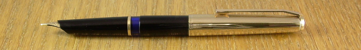 Pelikan M30 in profile, which shows both the interesting slope of the point and feed, and the narrow cartouche for engraving on the cap.