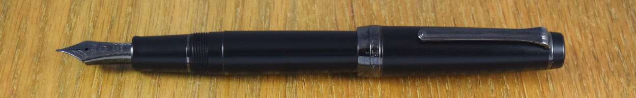 Sailor Professional Gear Imperial Black.  One of the tend growing since about 2010 for "stealth" pens, and since it's a trendy finish, it's at the expensive end of the line-up.